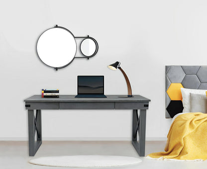 Modern room with Duramax Felix wood desk, featuring a laptop, lamp, and decor, highlighting the stylish 62-inch wood veneer top and drawer.